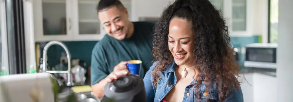 young couple in their kitchen at home