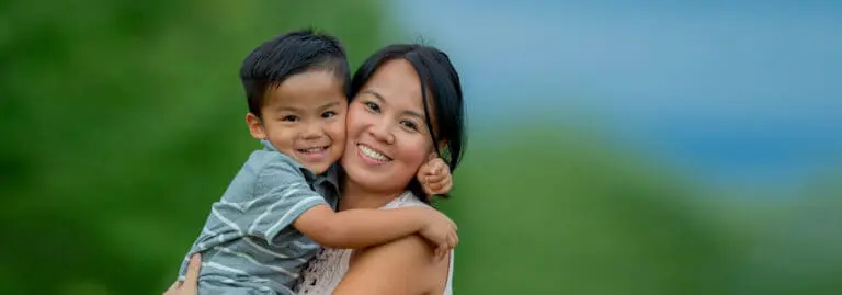 smiling young mother and son