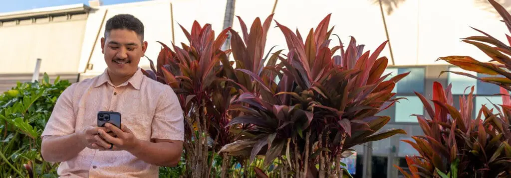 man checking rewards on phone