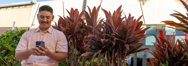 man checking rewards on phone