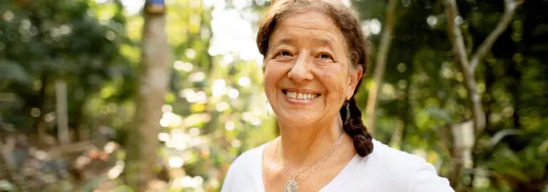 Smiling senior woman in a forest