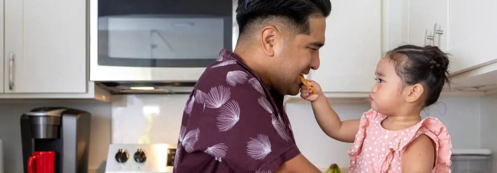 father and daugther in kitchen