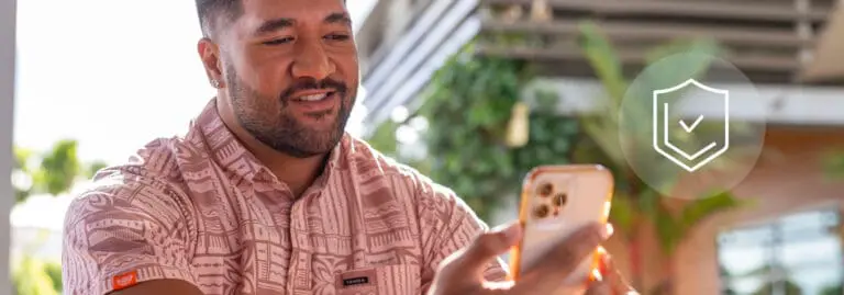 man looking at phone with security graphic overlay