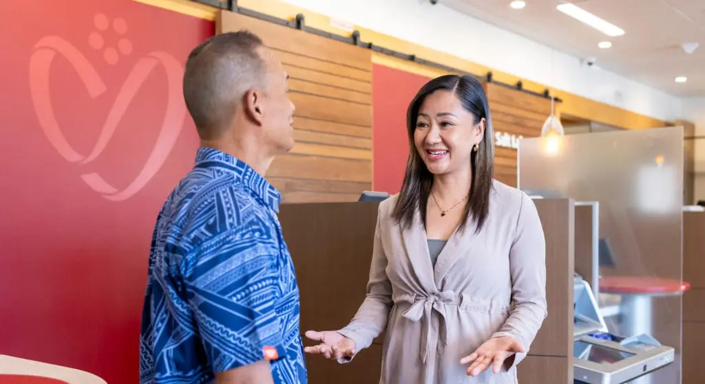 HSFCU member relationship officer talking to member at branch