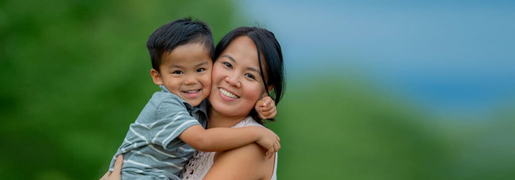 smiling young mother and son