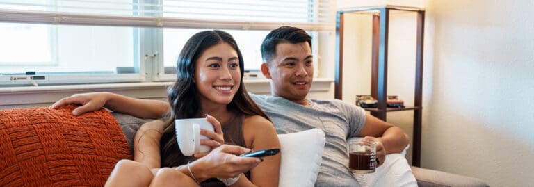 young couple relaxing on couch at home