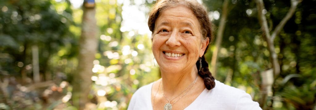 Smiling senior woman in a forest