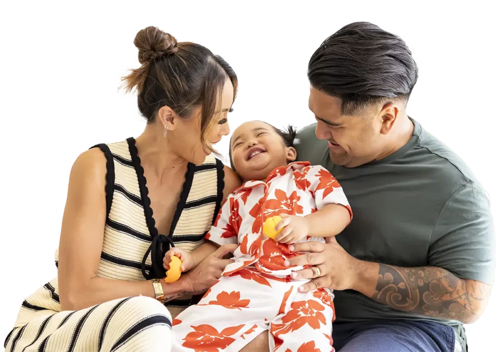 Parents on couch with young daughter