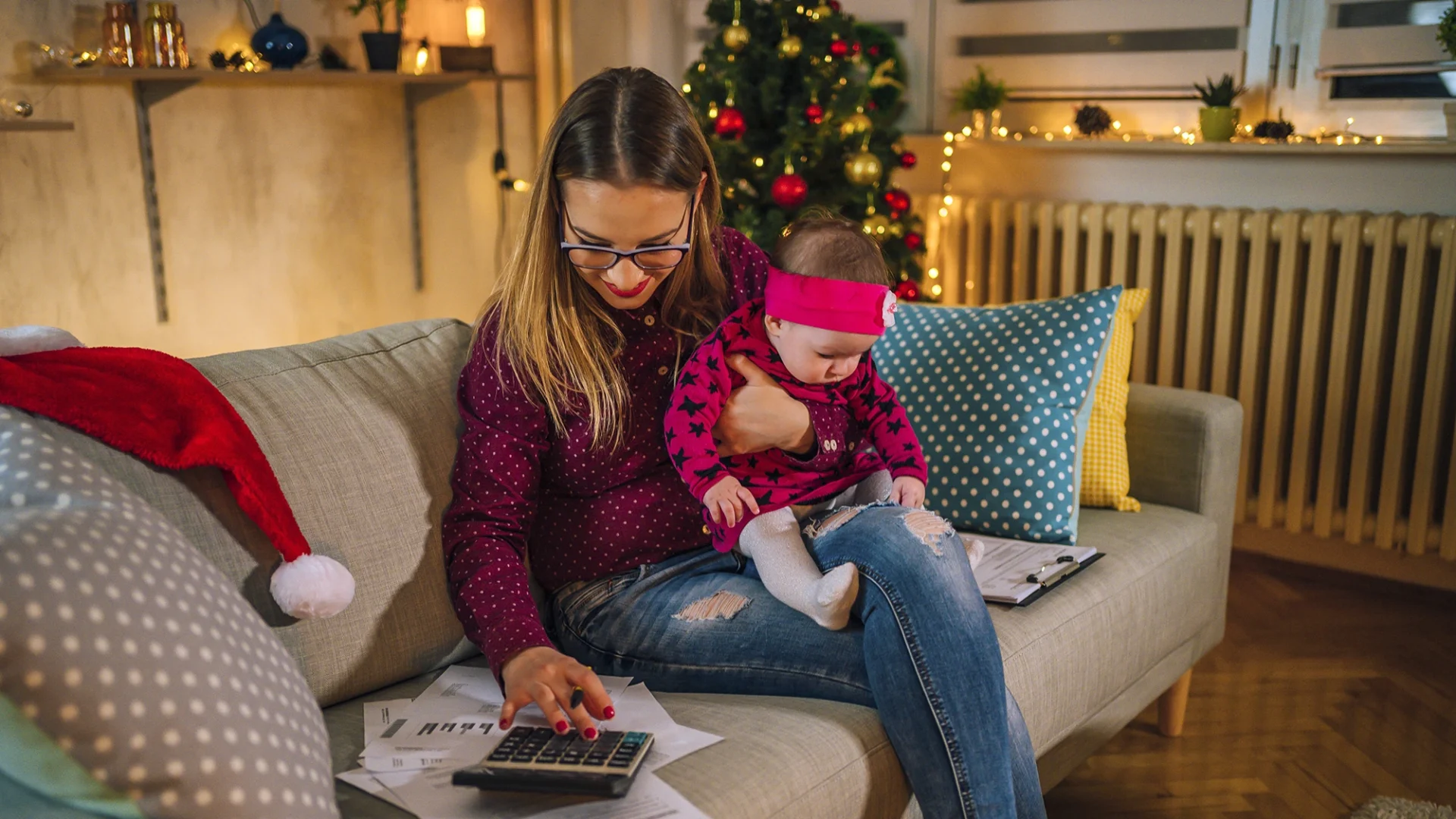 mother and baby planning holiday budget