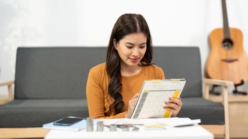 woman sitting and planning financial goals