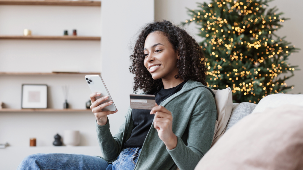 woman holiday shopping with credit card
